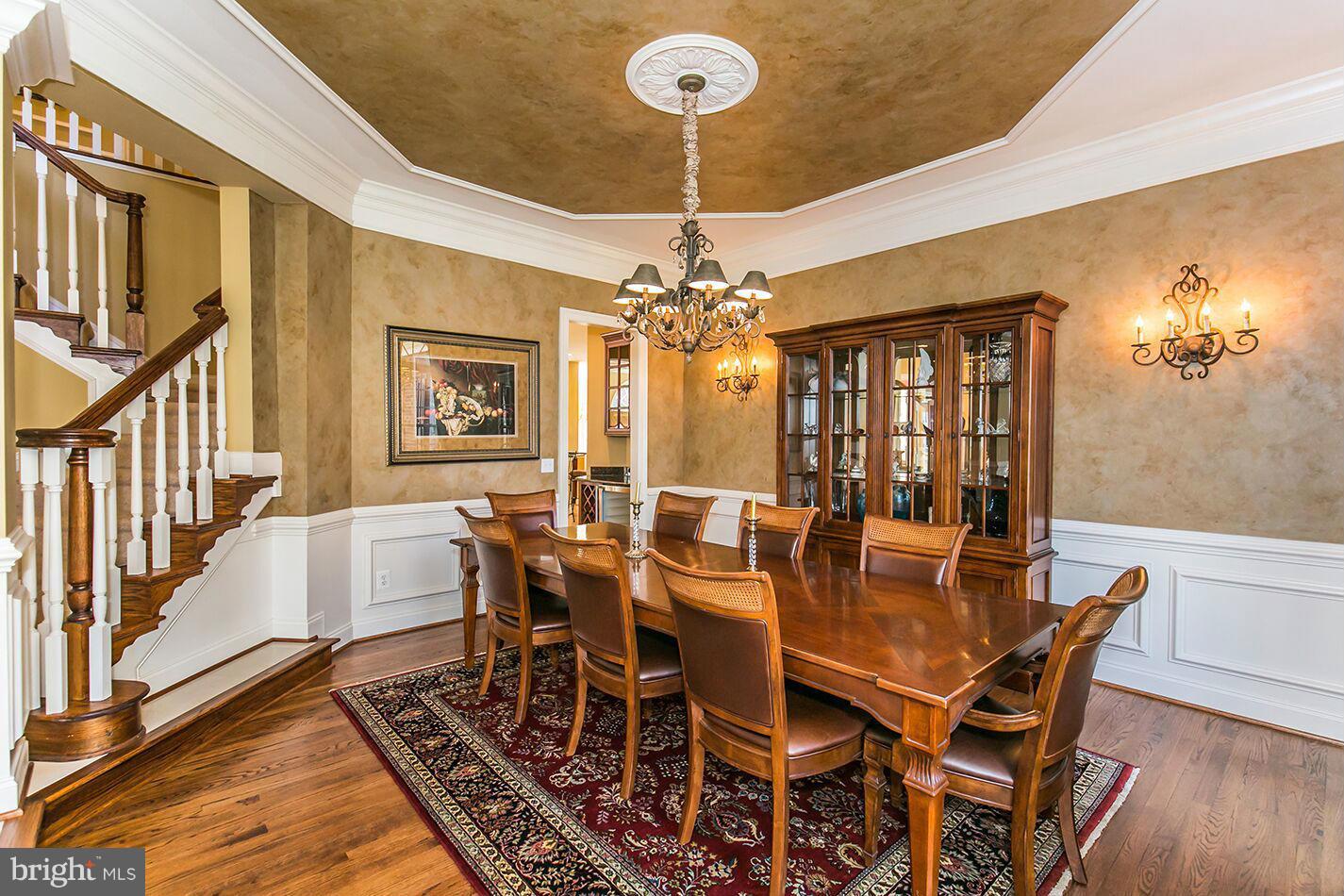 604 Clear Spring Road Great Falls, VA 22066 - Photo 3 of 28 a view of a dining room with furniture and chandelier
