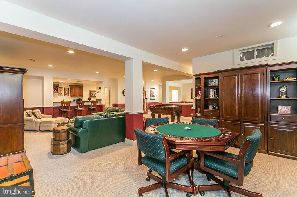 604 Clear Spring Road Great Falls, VA 22066 - Photo 21 of 28 a dining room with furniture and a kitchen view