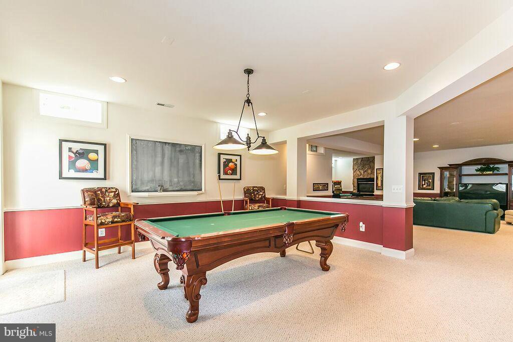 604 Clear Spring Road Great Falls, VA 22066 - Photo 22 of 28 a living room with furniture pool table and window