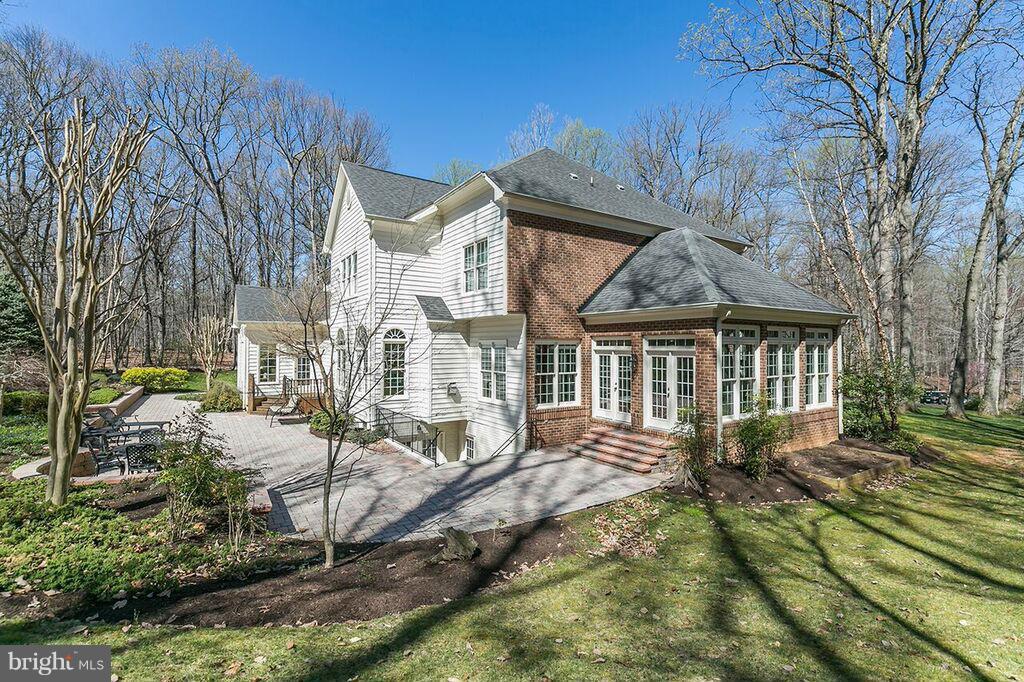 604 Clear Spring Road Great Falls, VA 22066 - Photo 25 of 28 a view of a house with a yard