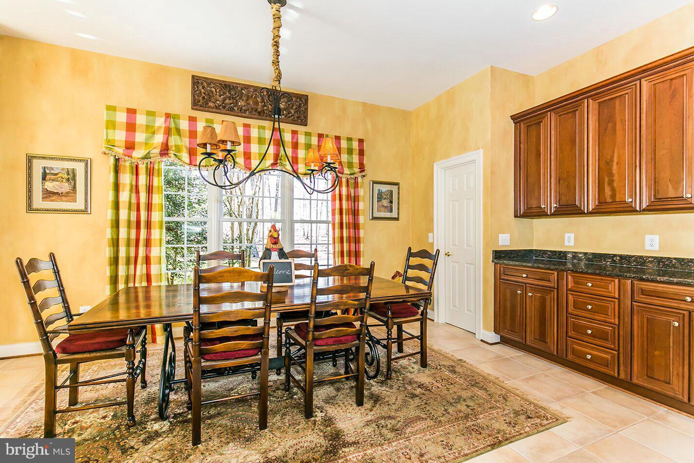 604 Clear Spring Road Great Falls, VA 22066 - Photo 6 of 28 a view of a dining room with furniture