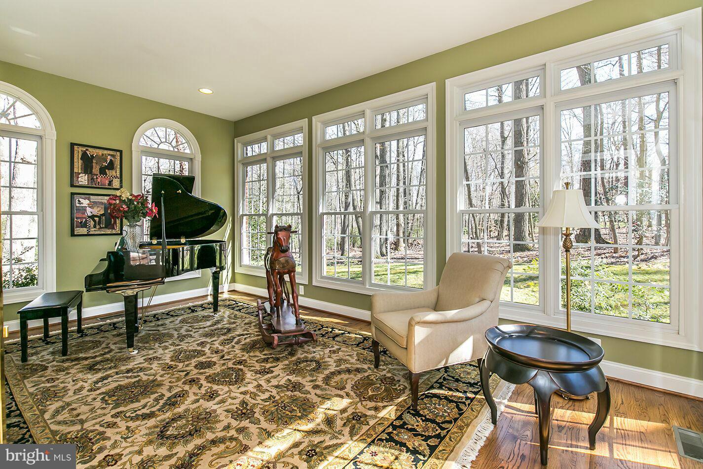 604 Clear Spring Road Great Falls, VA 22066 - Photo 9 of 28 a living room with furniture and a large window
