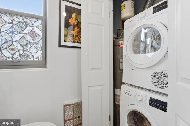 a utility room with dryer and washer