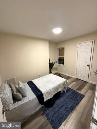 a bedroom with bed and window