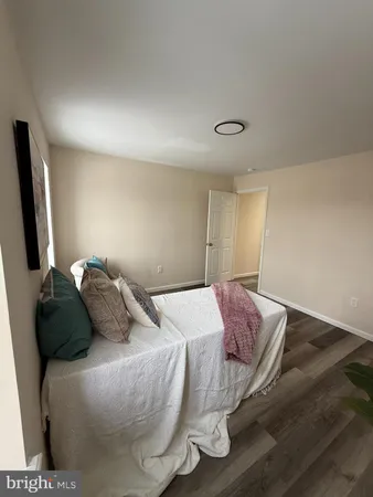 a bedroom with a bed and a television