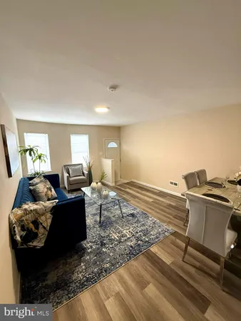 a living room with furniture and a table