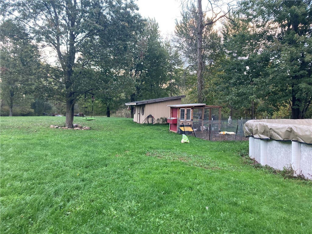 8751 West Canal Road Sweden, NY 14420 - Photo 31 of 34 Past photo of the yard Summer time