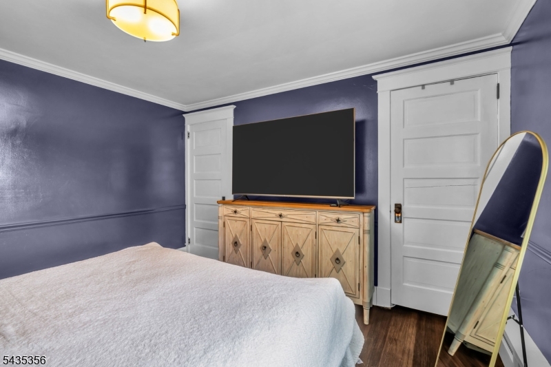 105 Somerville Road Bedminster, NJ 07921 - Photo 16 of 36 a bedroom with a bed and flat screen tv