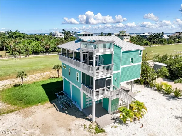 a aerial view of a house with a yard
