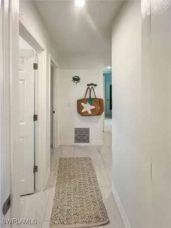 a bedroom with furniture and a wooden floor