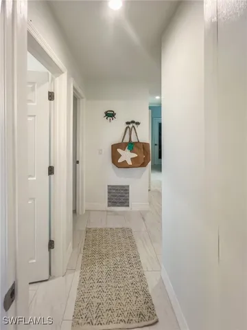 a bedroom with furniture and a wooden floor