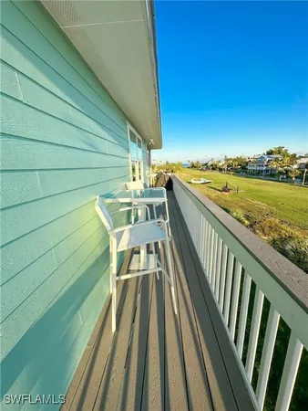 a view of a balcony with chairs