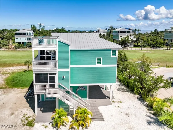a view of a house with a ocean view