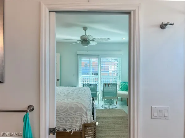 a bedroom with a large bed and a flat screen tv