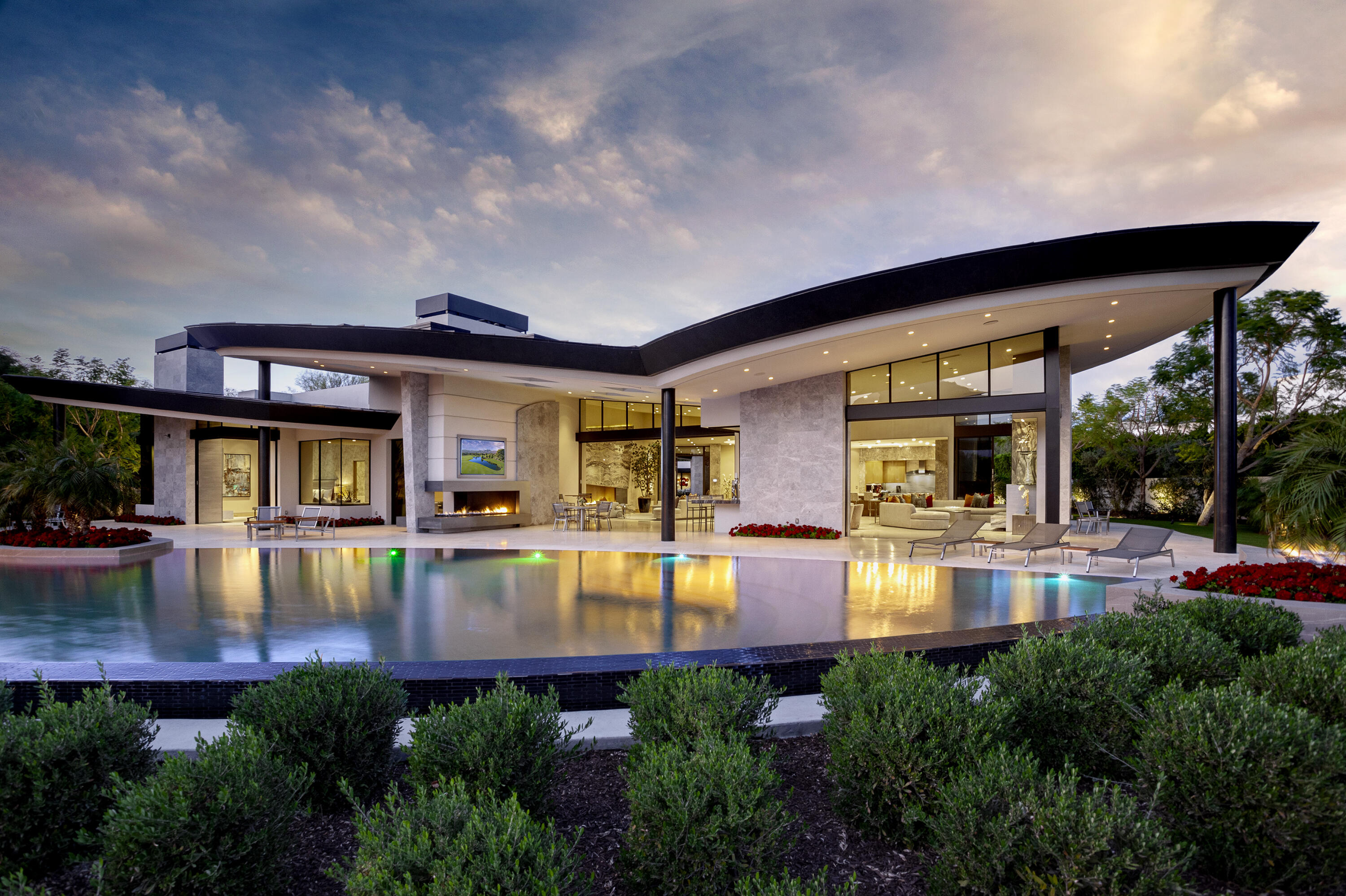 a view of an house with swimming pool and porch