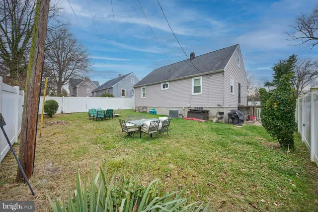 a view of a patio with a table and chairs
