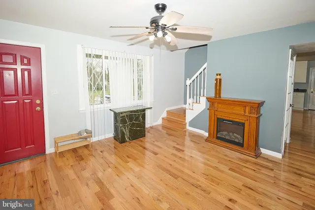 a view of livingroom with hardwood floor and a fireplace