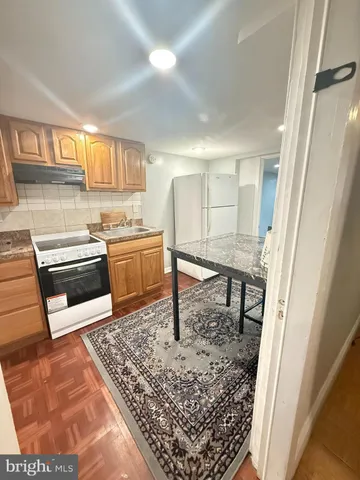 a room with lots of furniture and rug