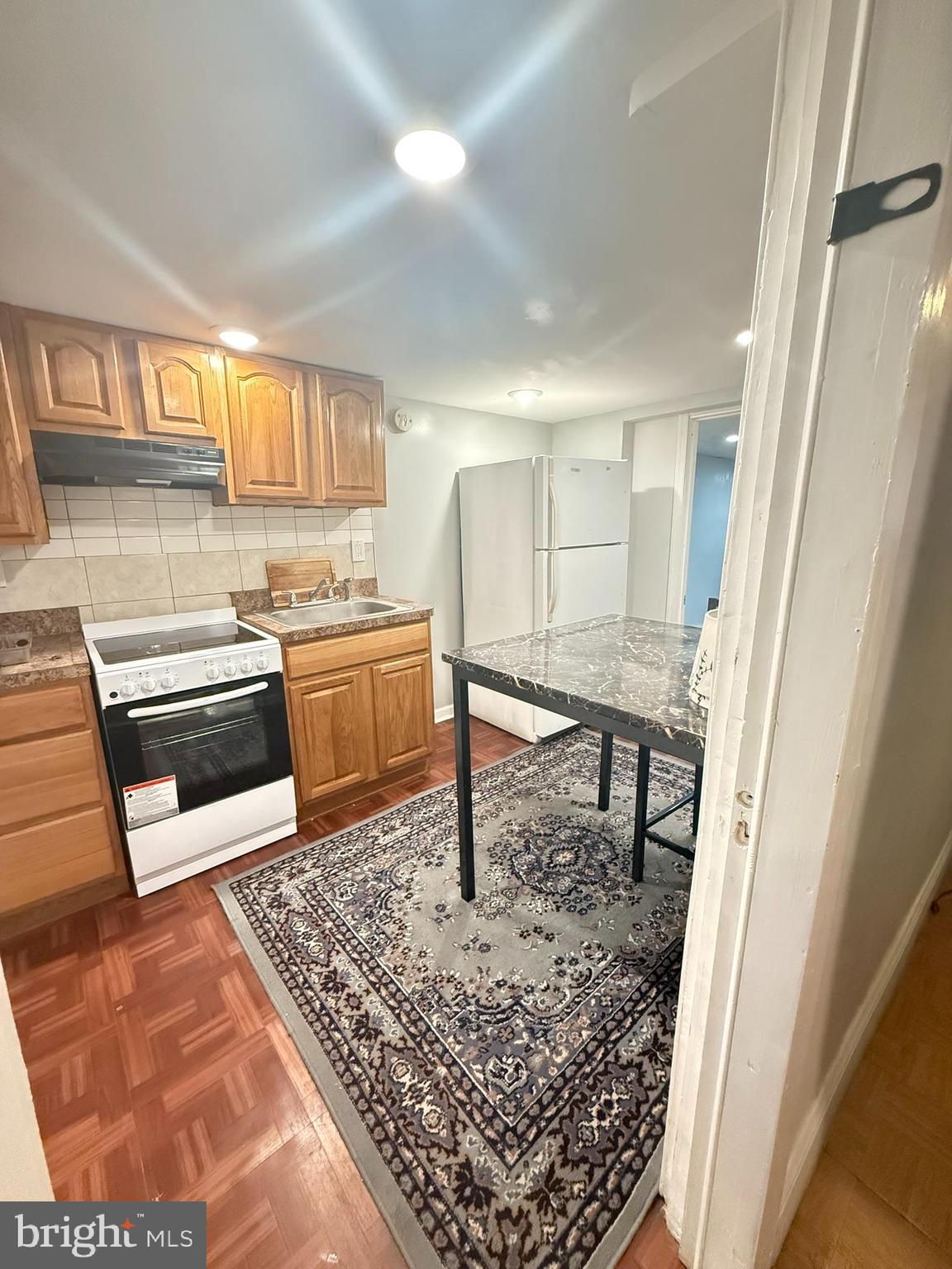 7547 Beverly Road Philadelphia, PA 19138 - Photo 15 of 32 a kitchen with stainless steel appliances granite countertop a sink stove and cabinets