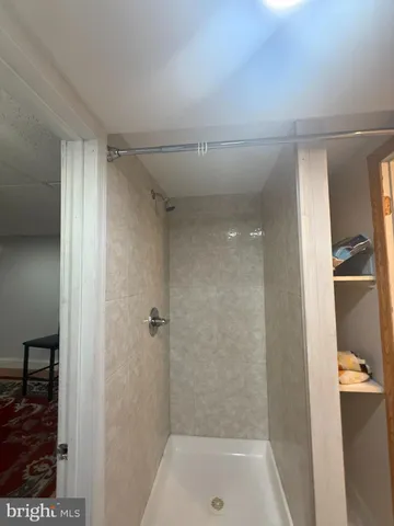 a kitchen with stainless steel appliances granite countertop a table chairs sink and cabinets