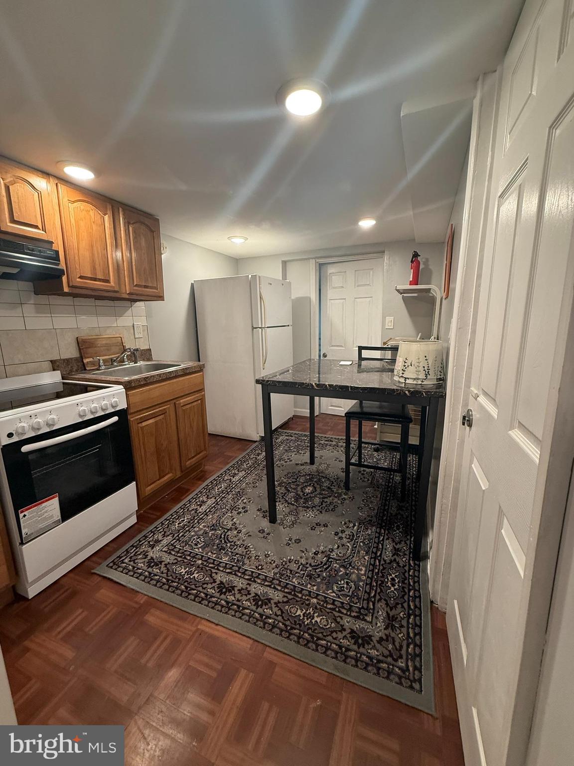 7547 Beverly Road Philadelphia, PA 19138 - Photo 25 of 32 a kitchen with a table chairs and a window