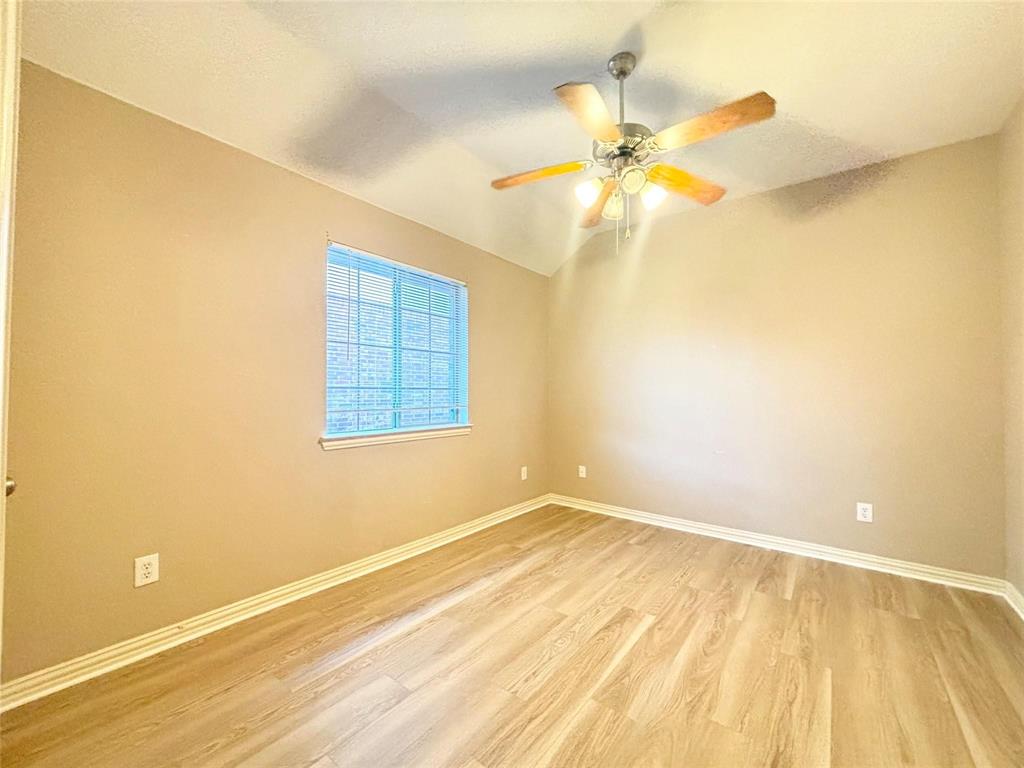9416 Harrell Drive McKinney, TX 75072 - Photo 11 of 16 a view of a room with a window and ceiling fan
