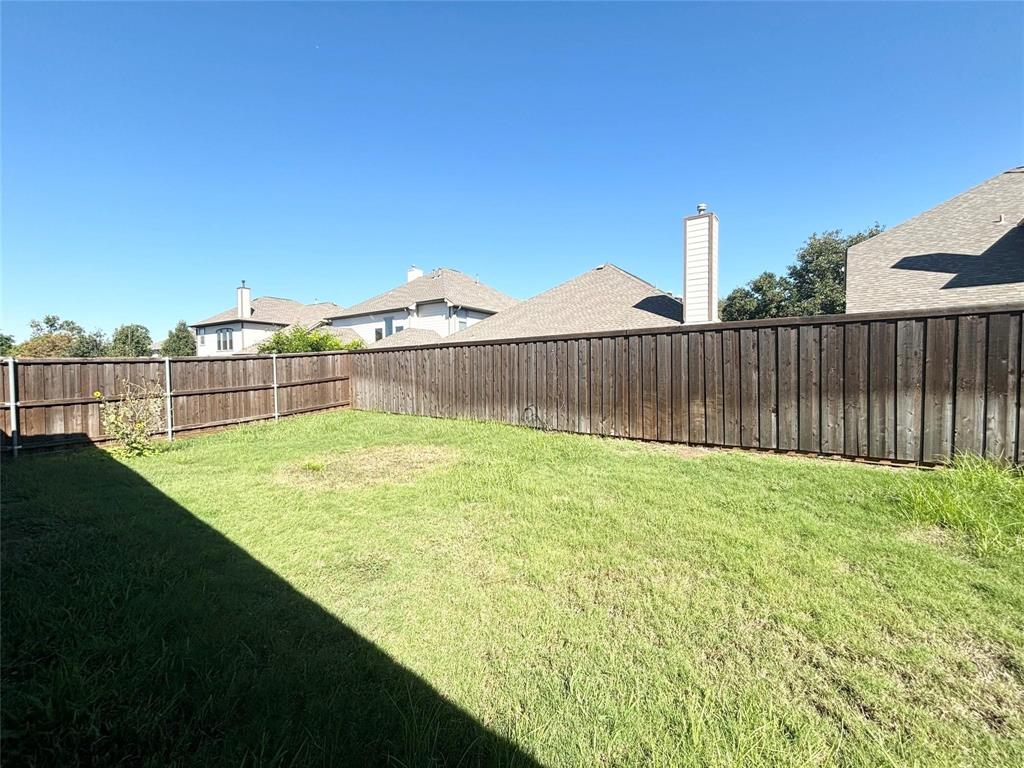 9416 Harrell Drive McKinney, TX 75072 - Photo 16 of 16 a view of a garden with a small yard
