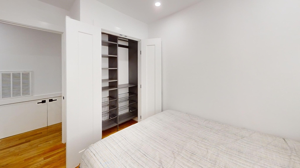 36 Shepard Street, Unit 1 Boston, MA 02135 - Photo 21 of 29 a view of bedroom with wooden floor