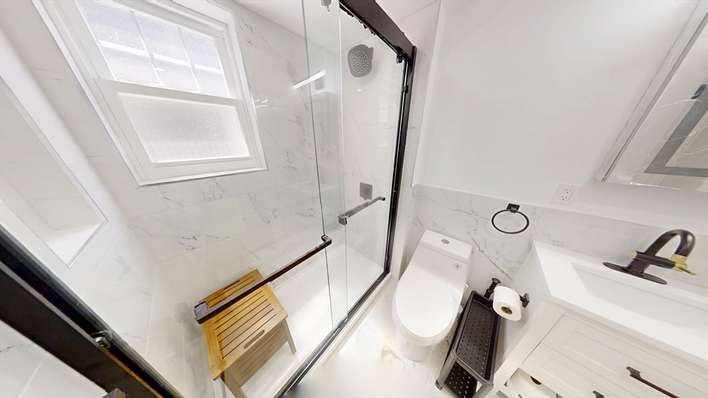 36 Shepard Street, Unit 1 Boston, MA 02135 - Photo 6 of 29 a bathroom with a tub