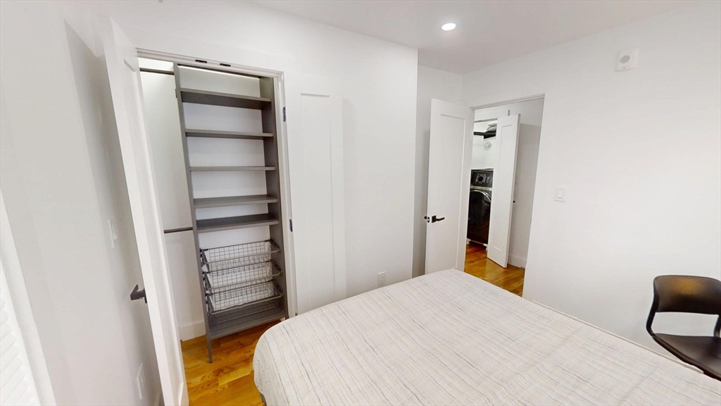 36 Shepard Street, Unit 1 Boston, MA 02135 - Photo 9 of 29 a bedroom with a bed and a closet