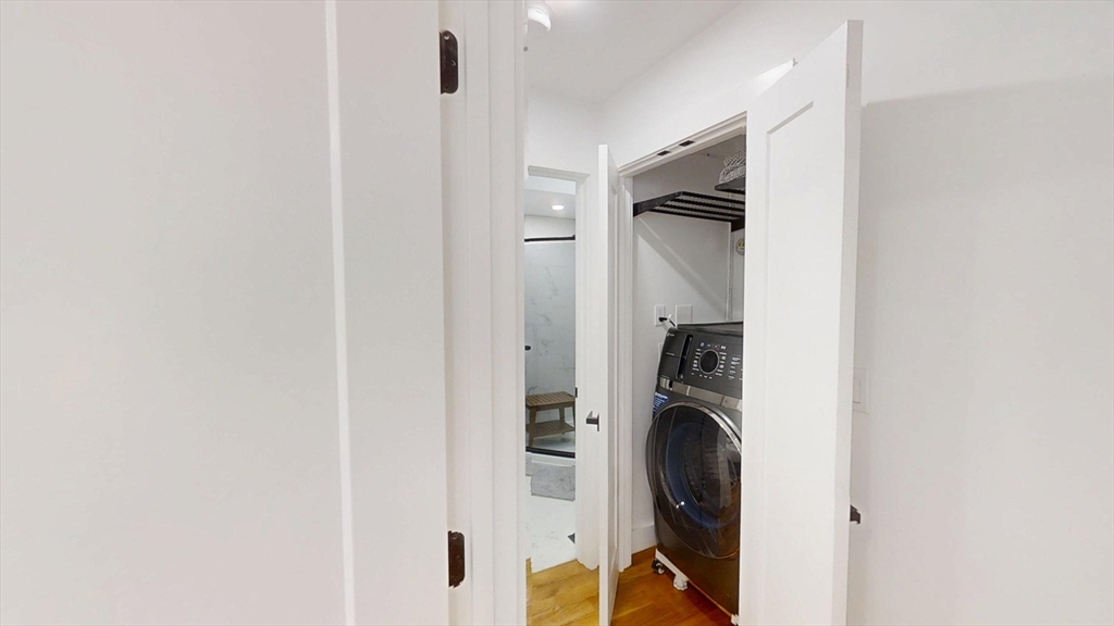 36 Shepard Street, Unit 1 Boston, MA 02135 - Photo 10 of 29 a utility room with dryer and washer