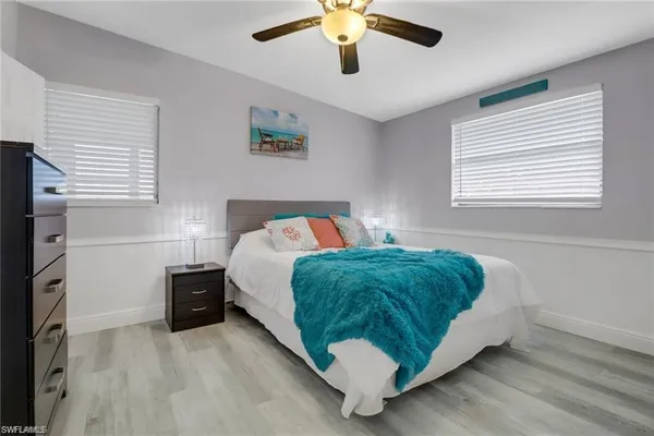 a bedroom with a bed and window