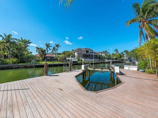 a view of a lake with houses in the back