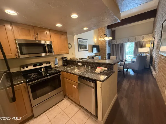 a kitchen with a stove and a sink