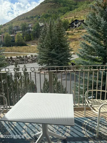 a view of balcony with wooden floor and yard
