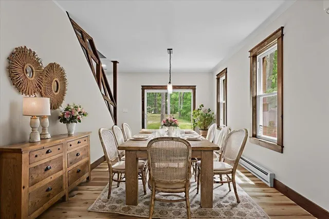 a view of a dining room with furniture window and wooden floor