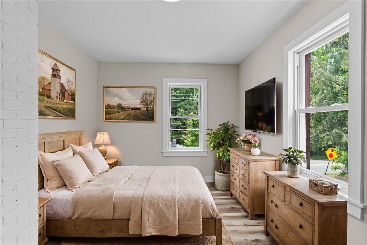 15 Locust Ridge Road Thornhurst, PA 18424 - Photo 13 of 48 a bedroom with a large bed and a flat tv screen on dresser