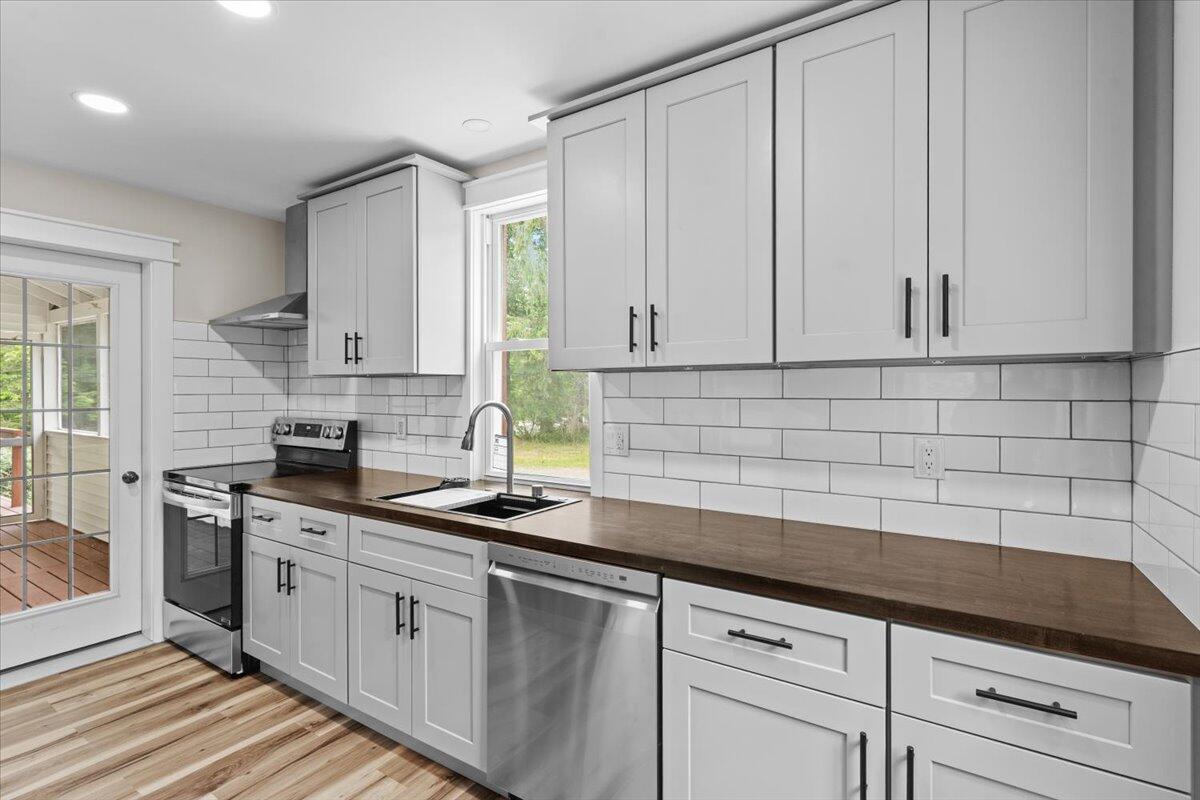 15 Locust Ridge Road Thornhurst, PA 18424 - Photo 21 of 48 a kitchen with stainless steel appliances granite countertop white cabinets a sink and dishwasher