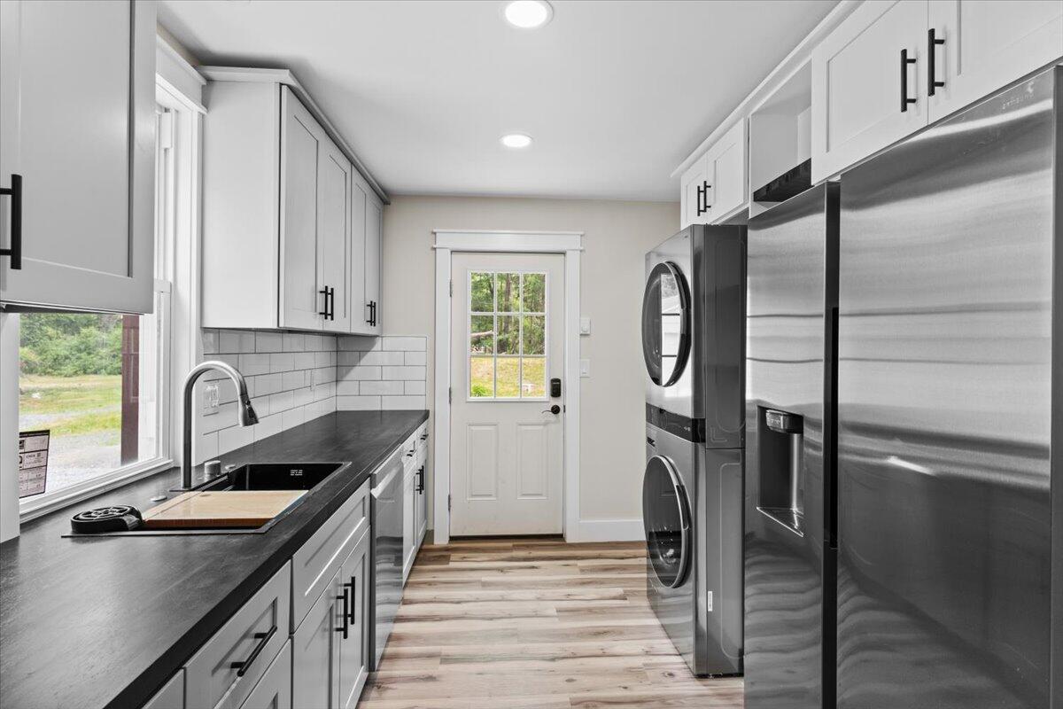 15 Locust Ridge Road Thornhurst, PA 18424 - Photo 22 of 48 a kitchen with stainless steel appliances granite countertop a sink refrigerator and cabinets