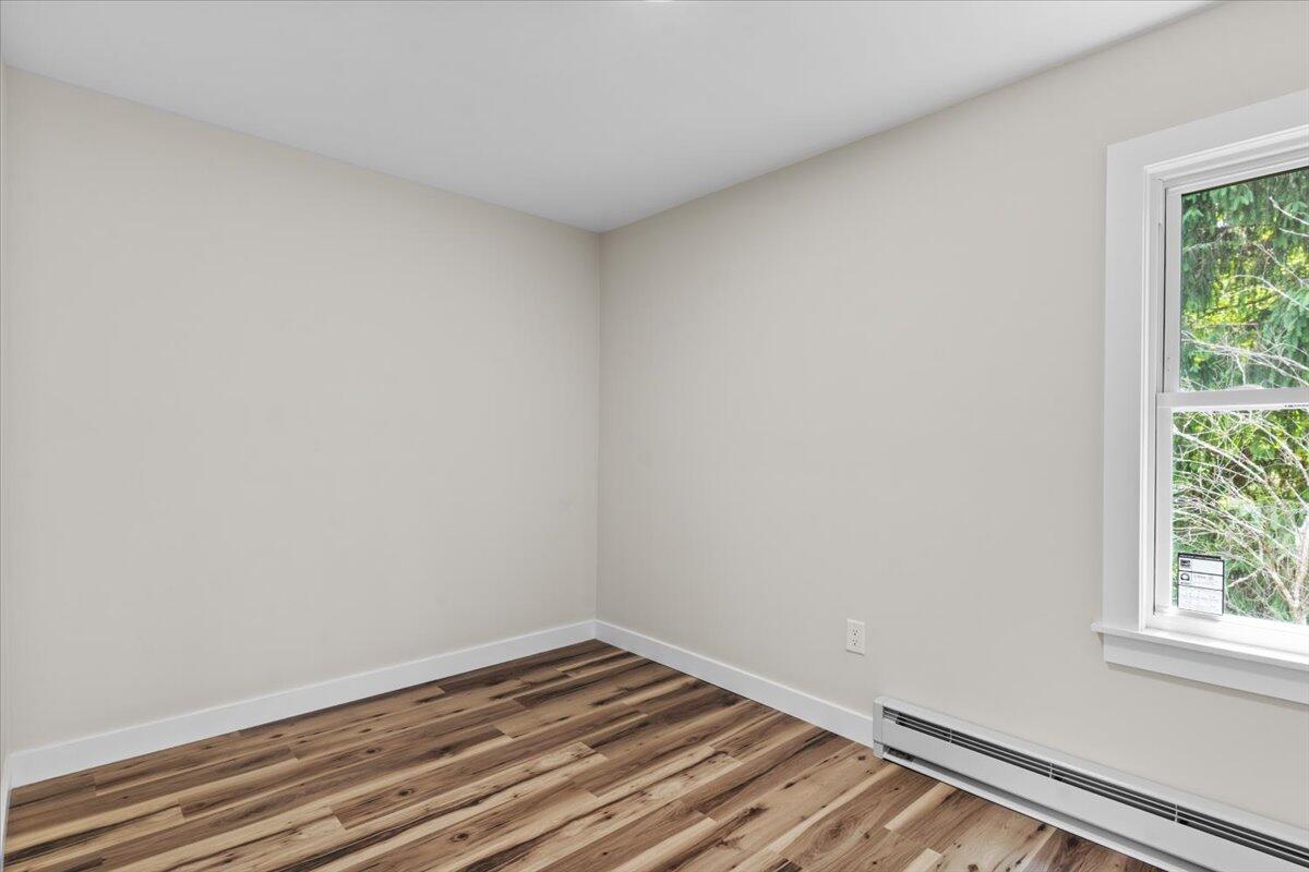 15 Locust Ridge Road Thornhurst, PA 18424 - Photo 32 of 48 a view of a room that has wooden floor and white walls