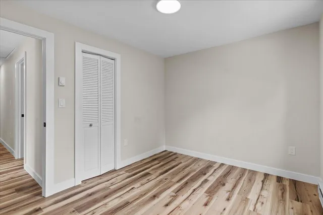 a view of room with wooden floor