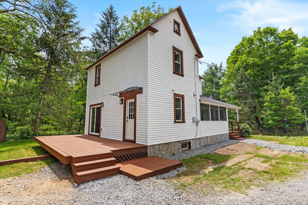 15 Locust Ridge Road Thornhurst, PA 18424 - Photo 4 of 48 a backyard of a house with yard and outdoor seating