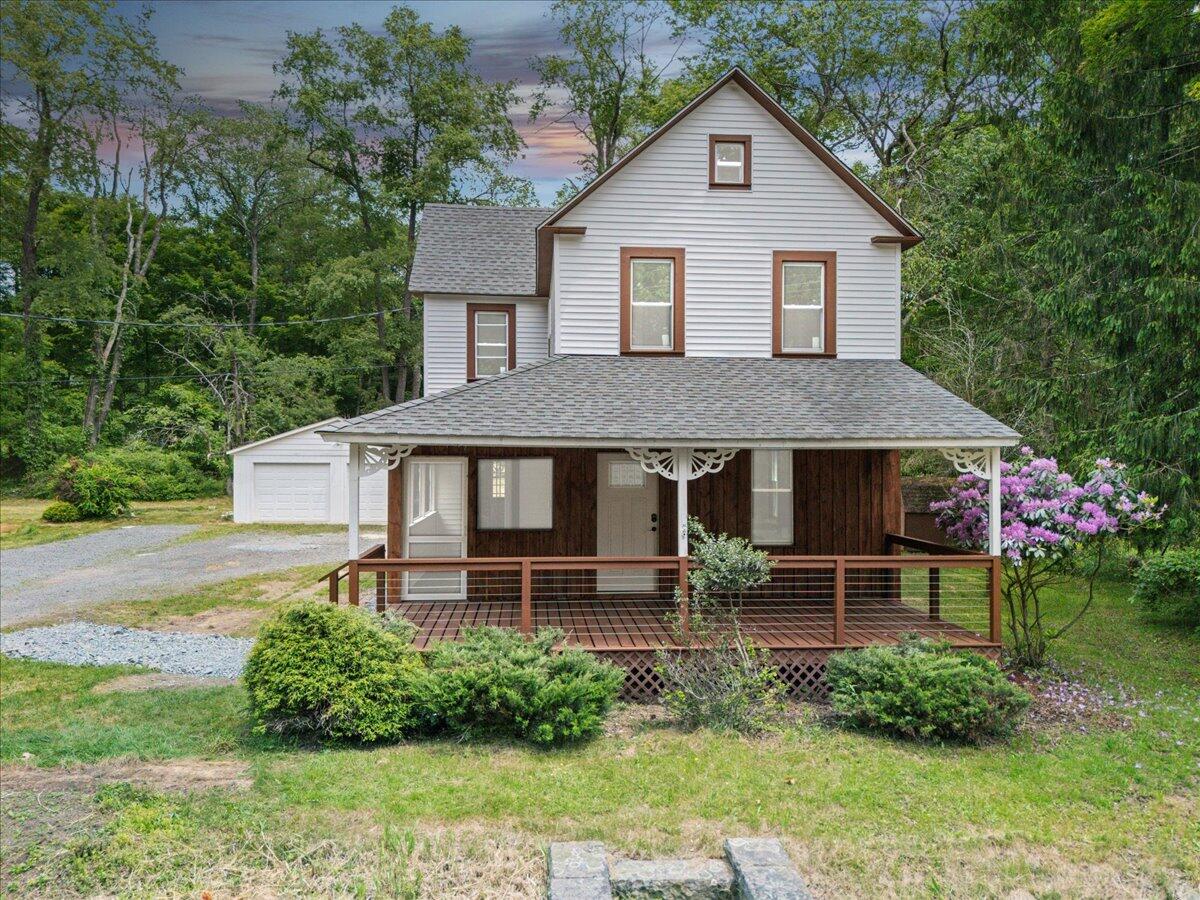 15 Locust Ridge Road Thornhurst, PA 18424 - Photo 45 of 48 a front view of a house with a yard table and chairs