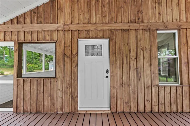 a view of a door and wooden floor