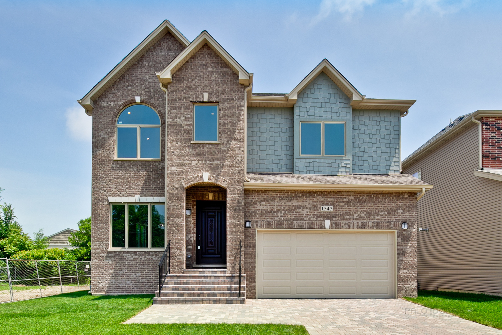 1747 Greenwood Road Glenview, IL 60026 - Photo 1 of 46 a front view of a house with a yard and garage