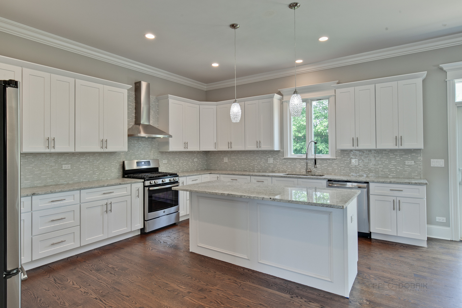 1747 Greenwood Road Glenview, IL 60026 - Photo 11 of 46 a kitchen with granite countertop white cabinets and white appliances