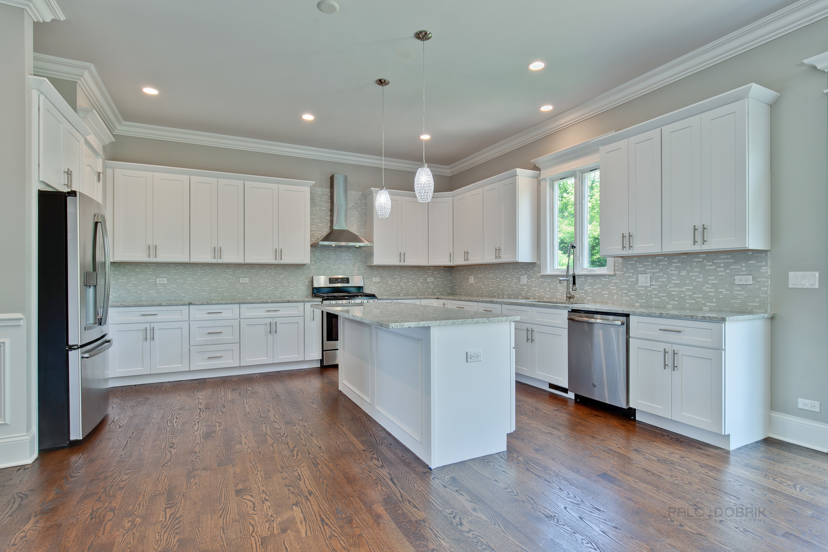 1747 Greenwood Road Glenview, IL 60026 - Photo 16 of 46 a kitchen with stainless steel appliances granite countertop a stove a sink and white cabinets