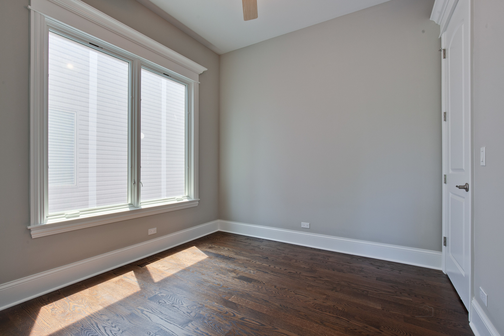 1747 Greenwood Road Glenview, IL 60026 - Photo 21 of 46 a view of an empty room with wooden floor and a window