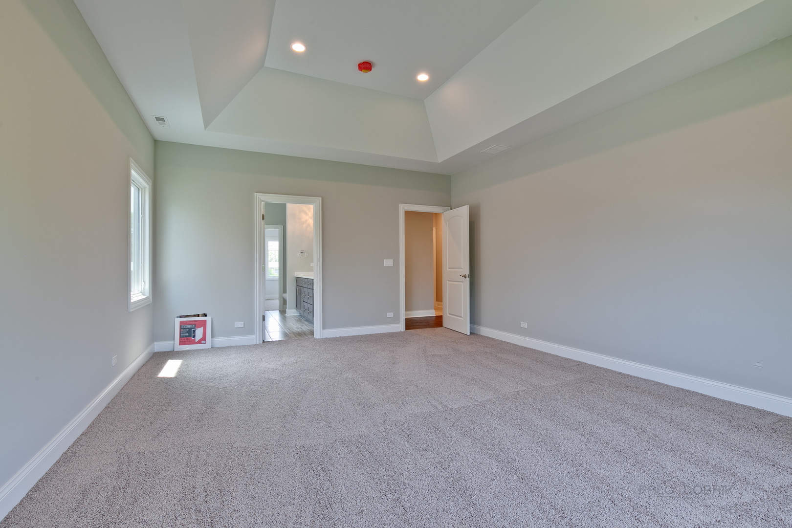 1747 Greenwood Road Glenview, IL 60026 - Photo 27 of 46 an empty room with large window and a potted plant