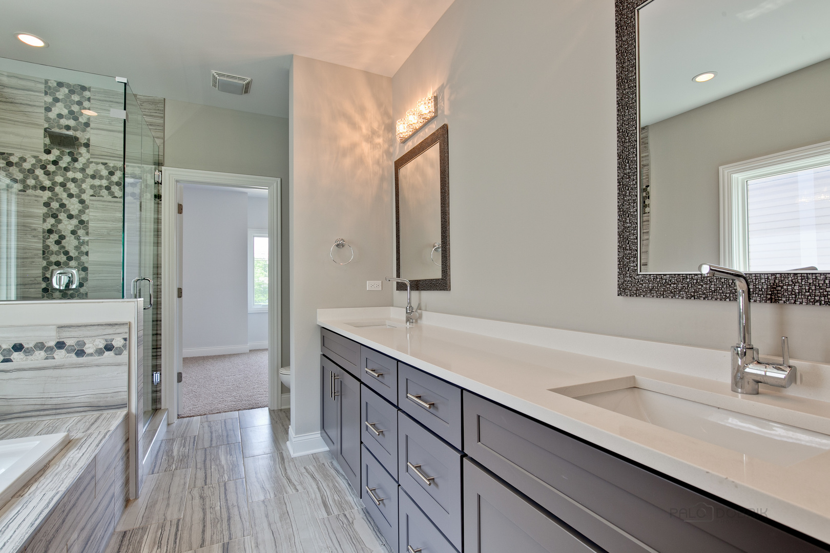 1747 Greenwood Road Glenview, IL 60026 - Photo 28 of 46 a bathroom with a double vanity sink mirror and shower